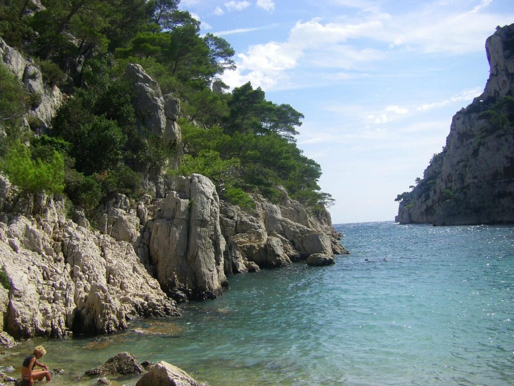 Calanque d'En-Vau, a stunning cove nestled between rocky cliffs in Provence, France, captivates with its turquoise waters and natural beauty.