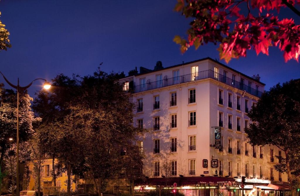 A grand facade of Hotel Duquesne Eiffel captures attention, its elegant architecture adorned with classic Parisian charm.