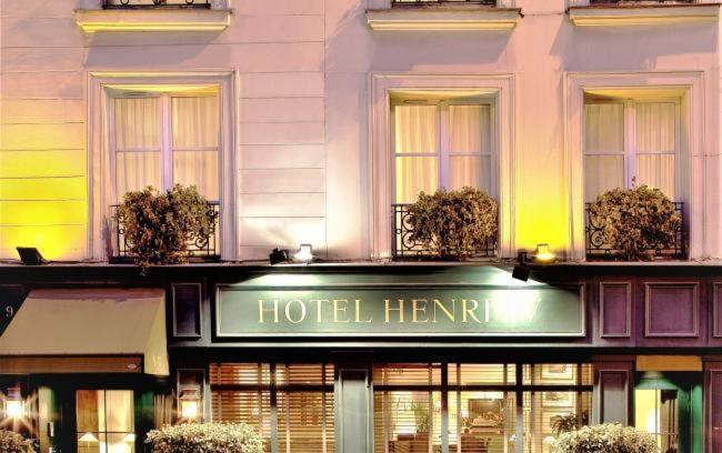 Hôtel Henri IV Rive Gauche welcomes guests with timeless charm, its historic facade adorned with intricate details reminiscent of classical Parisian architecture.