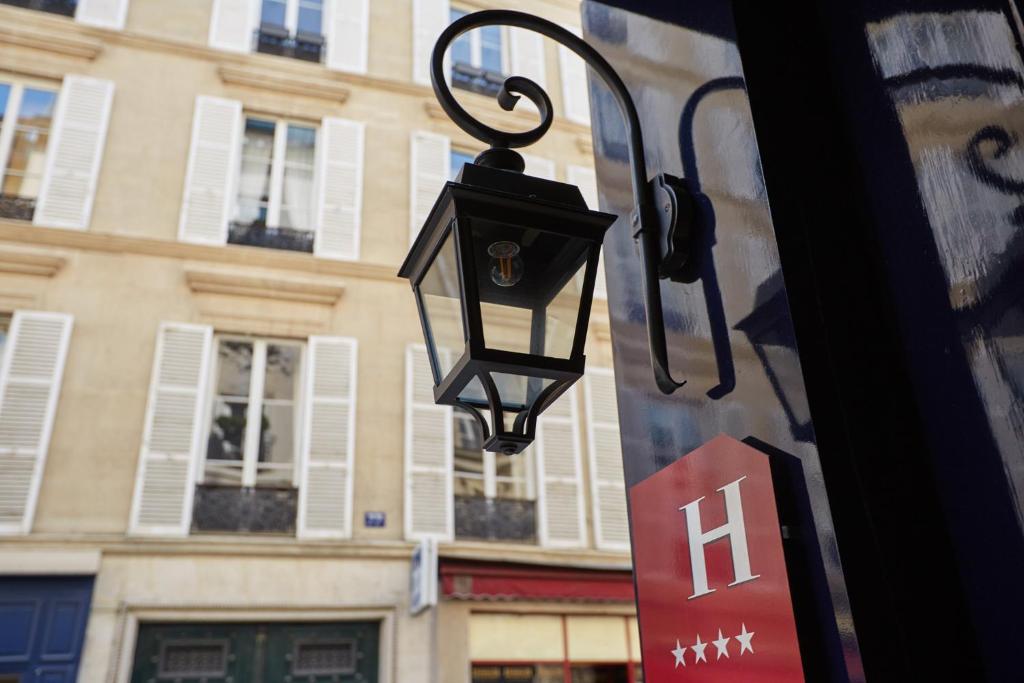 An immersive snapshot capturing the first impression of Hotel Saint Germain in Paris. The image may convey the enchanting facade of the hotel, welcoming guests with its architectural charm.