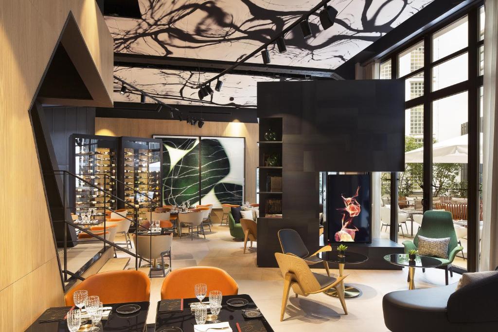 Indulge in a world of opulence at Le Cinq Codet Paris, where curated amenities include a gourmet restaurant, a chic lounge, fitness facilities, and personalized concierge services