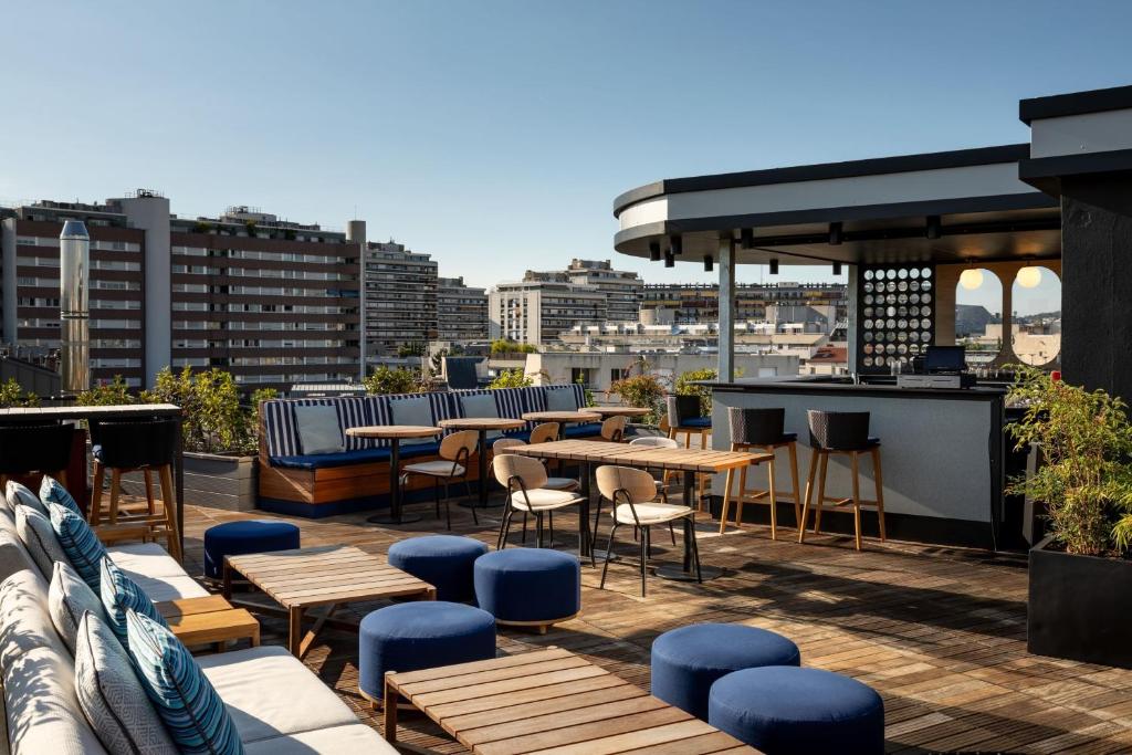 Le Parchamp, Paris Boulogne, a Tribute Portfolio Hotel, captivates with its elegant façade and modern design, welcoming guests into a luxurious haven in the heart of Paris.