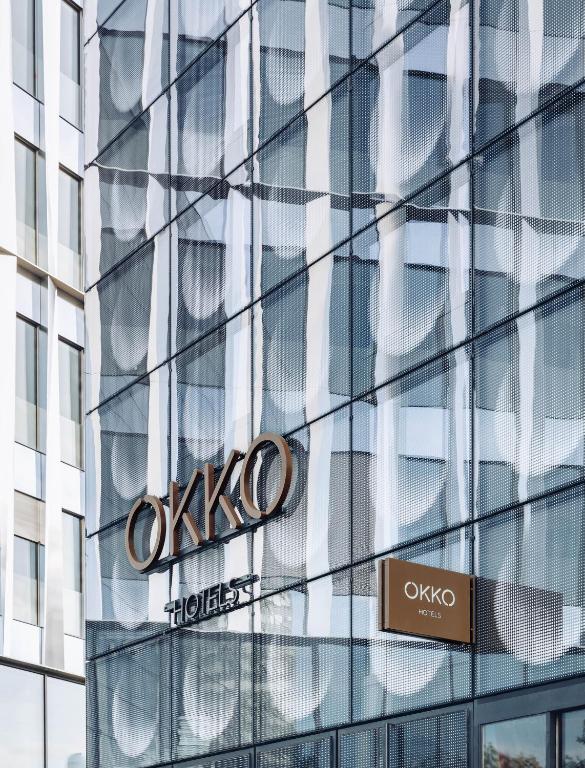 The exterior of OKKO Hotels Paris Porte De Versailles, featuring a modern and sleek design with clean lines and large windows that exude a sense of contemporary hospitality