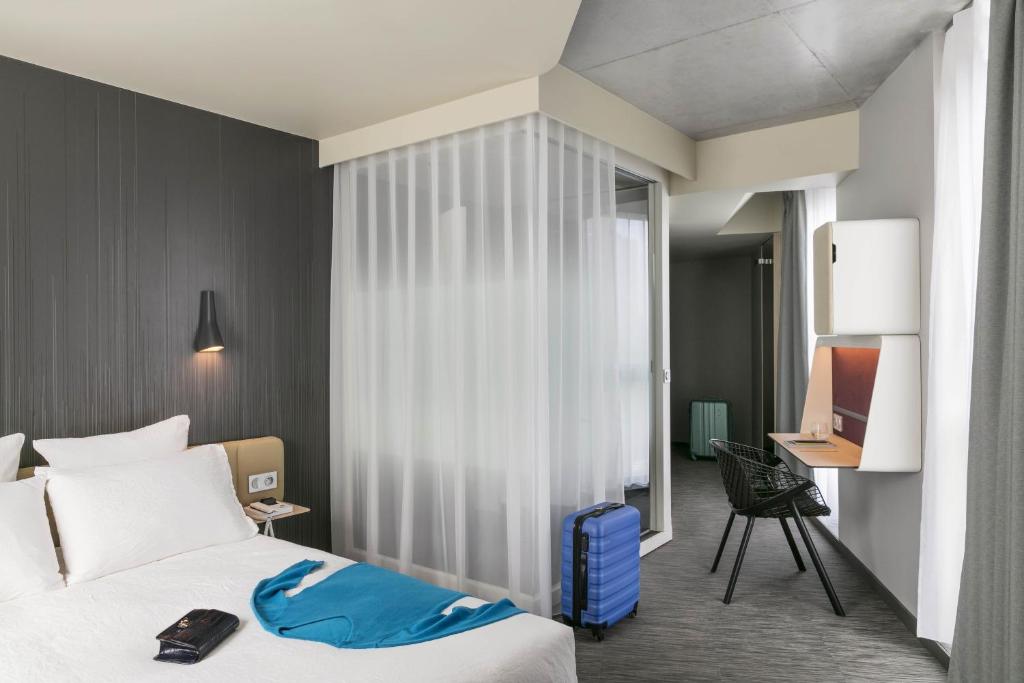 The room features a seamless fusion of comfort and sophistication, adorned with modern furnishings, plush bedding, and thoughtful amenities.