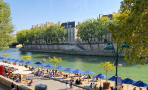 Paris Plage, the Seine River's urban beach, transforms the cityscape into a coastal retreat.