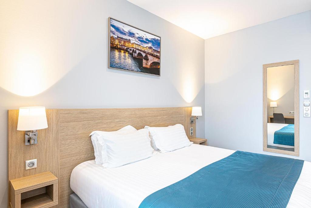 Indulge in comfort at Paris d'Issy Hôtel Porte de Versailles, where well-appointed rooms feature modern amenities, tasteful decor, and a welcoming ambiance.
