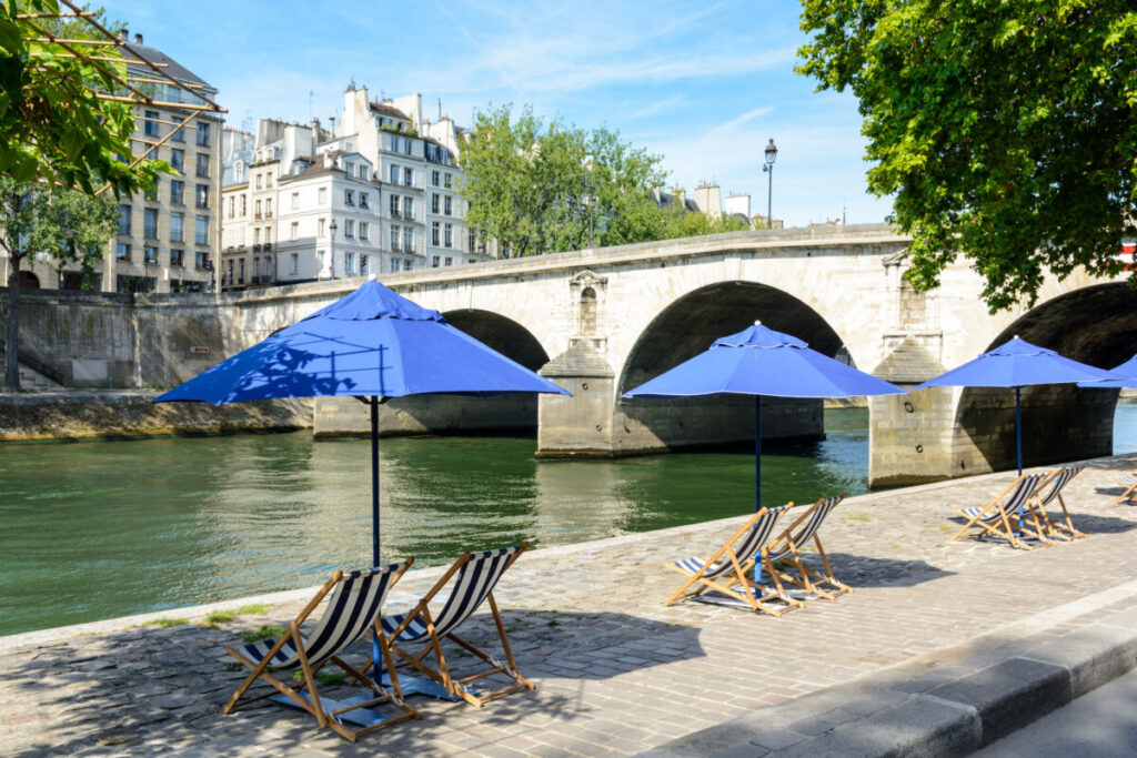 Paris Plages, an annual summer event, transforms the heart of the city into a vibrant urban beach.