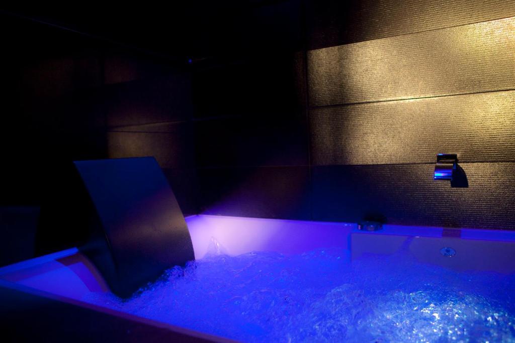 Secret de Paris - Hotel & Spa indulges guests with a range of lavish amenities, including a spa, fitness center, and chic lounges.