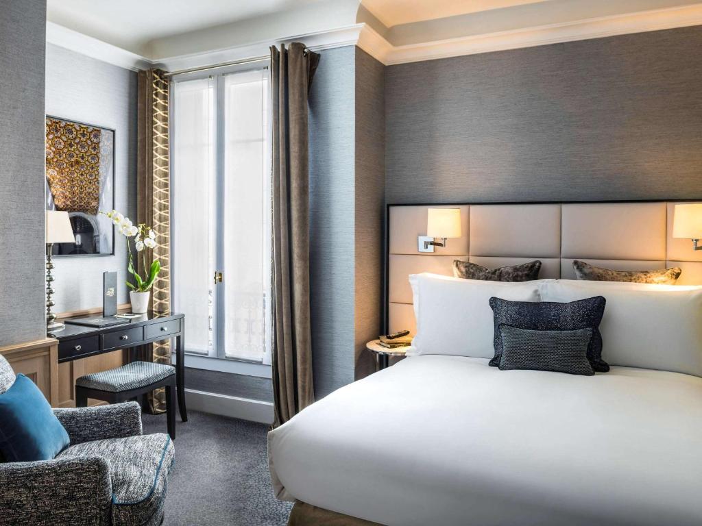 The rooms at Sofitel Paris Baltimore Tour Eiffel are a symphony of comfort and style, boasting plush furnishings, sumptuous bedding, and elegant decor that effortlessly merges contemporary design with timeless Parisian flair.