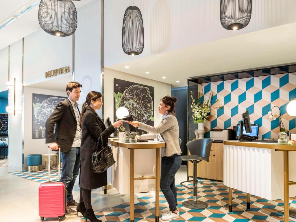 Step into the inviting lobby of Aparthotel Adagio Paris Centre Tour Eiffel, where contemporary design meets comfort.