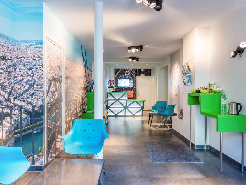 The lobby at ibis Styles Paris Eiffel Cambronne offers a chic and inviting atmosphere