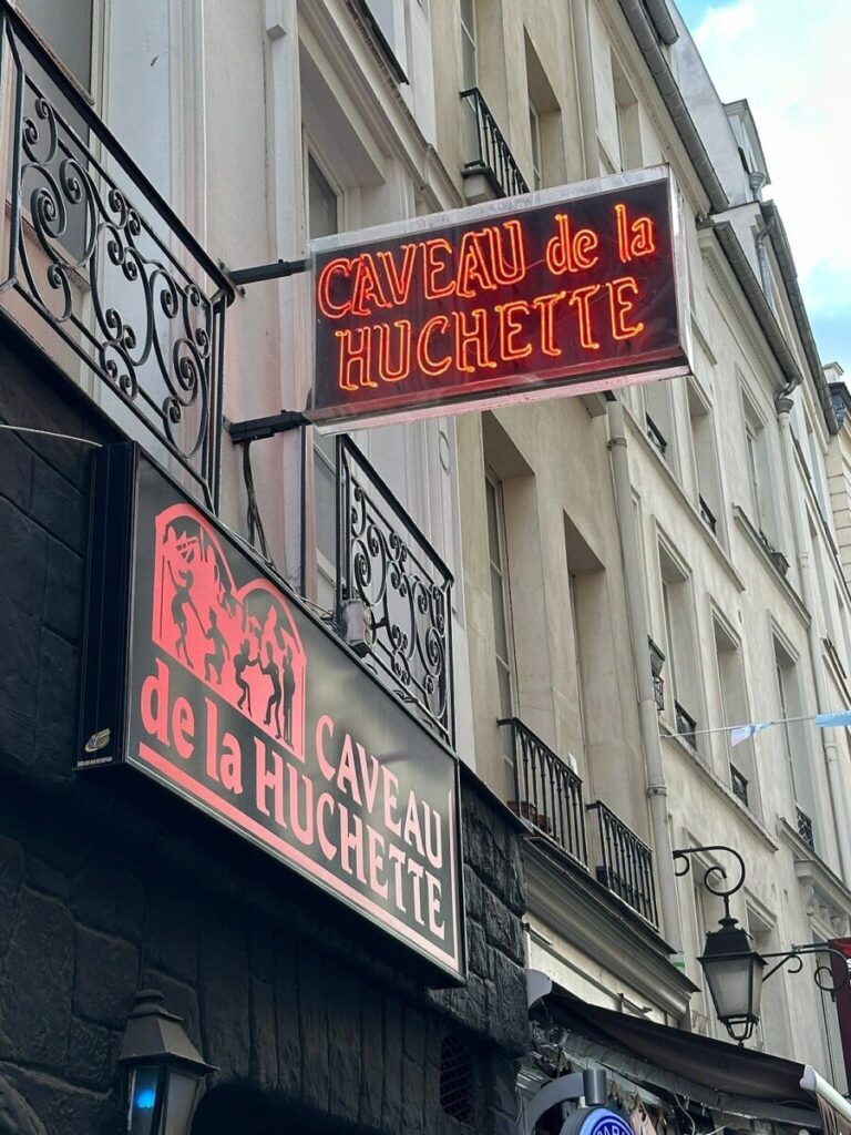 Signage at the Le Caveau de la Huchette