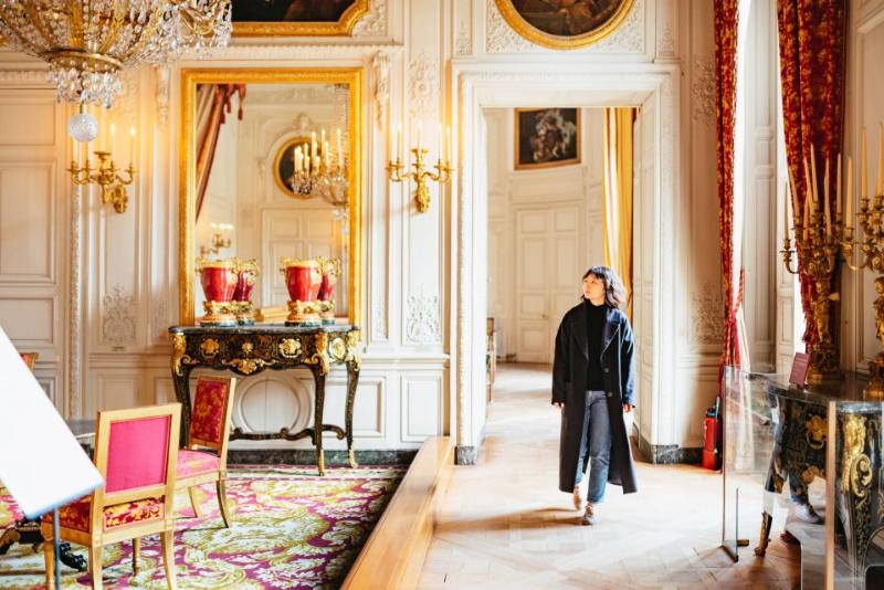 Tourist checking out Versailles Palace