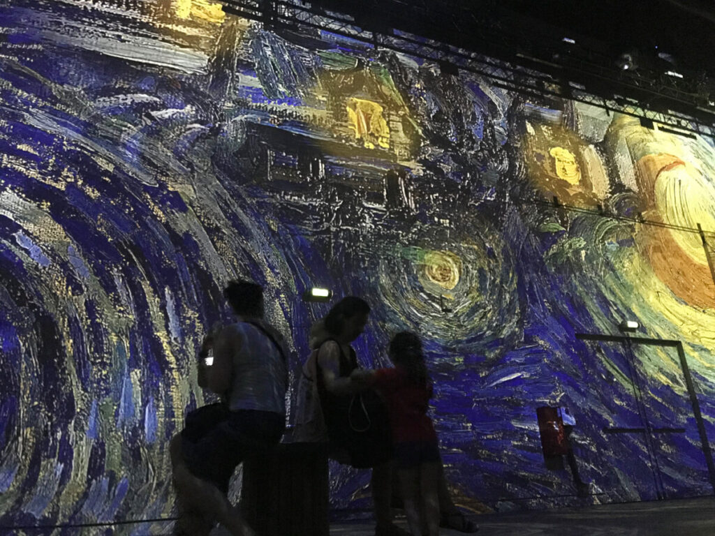 Van Gogh exhibition at The Atelier des Lumières in Paris, showcasing immersive art experiences and vibrant projections