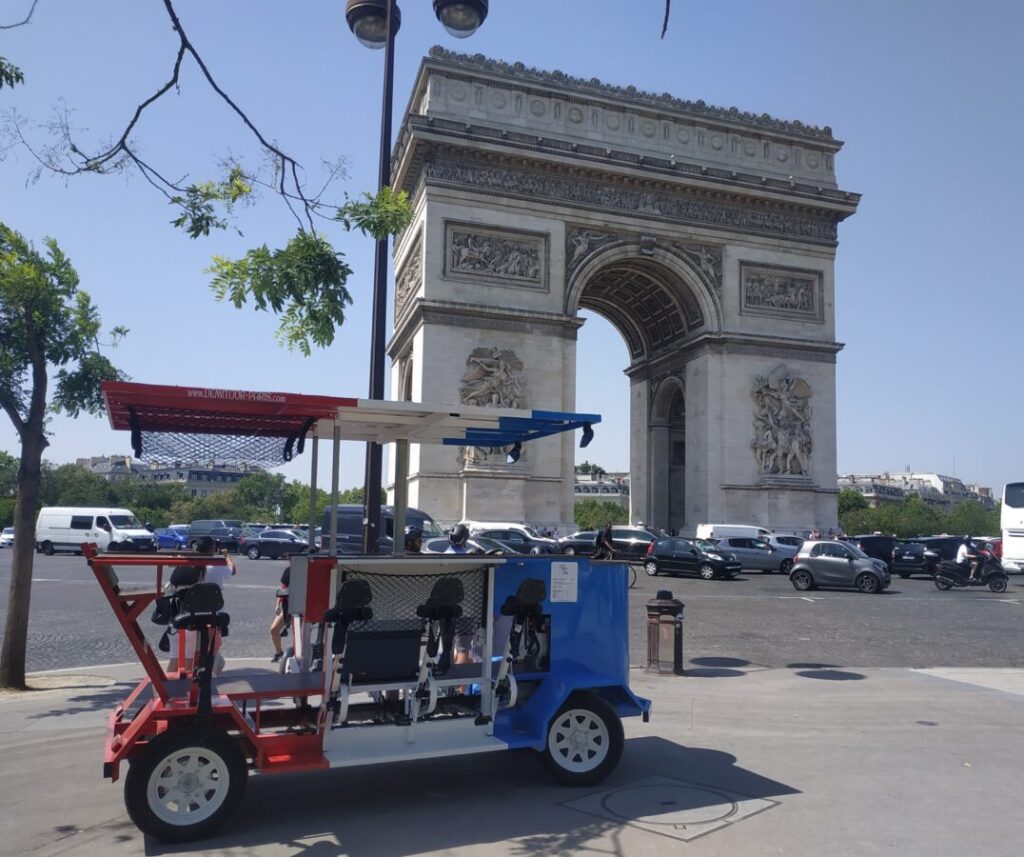 Beer bike in front of Arc de Triomphe in Paris