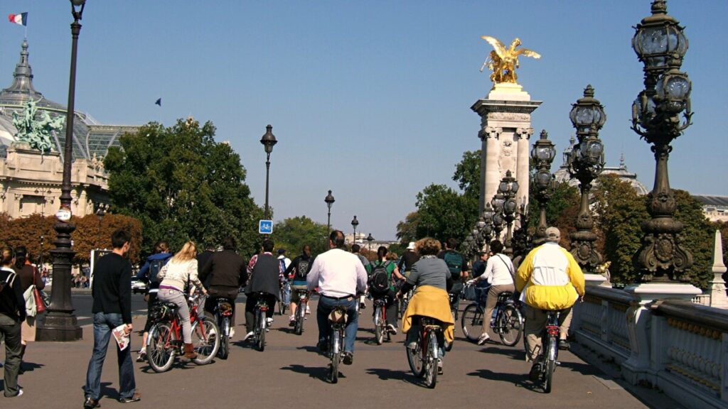 Group of people biking around in Paris, France