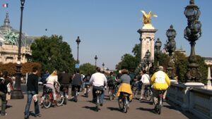Group of people biking around in Paris, France