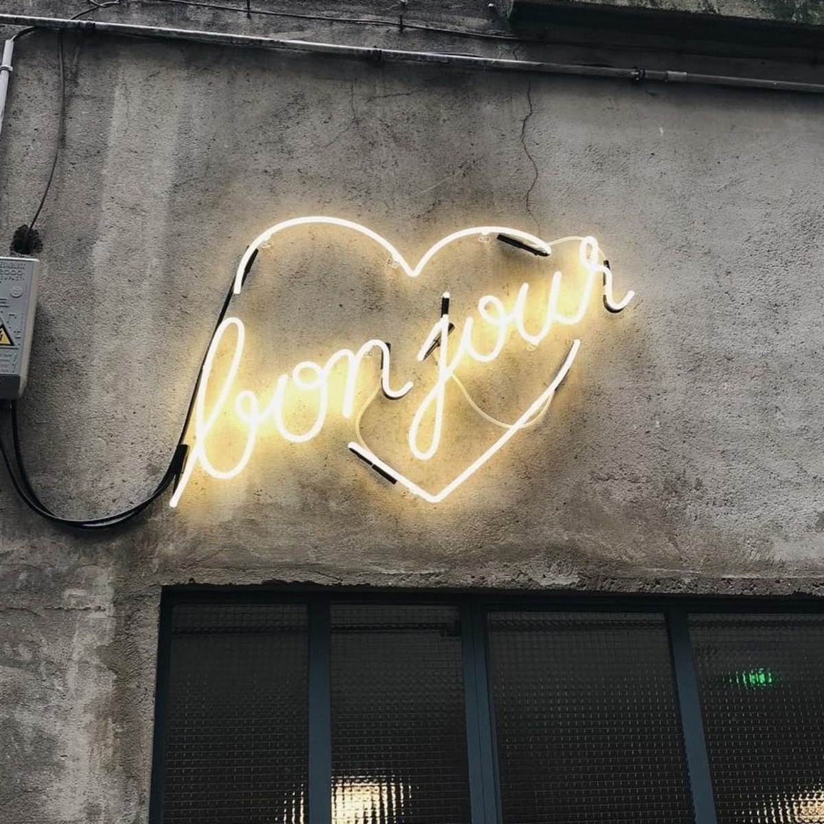 Neon sign reading "Bonjour Tattoo Club" illuminated with LED lights Bonjour Tattoo Club Shop Sign