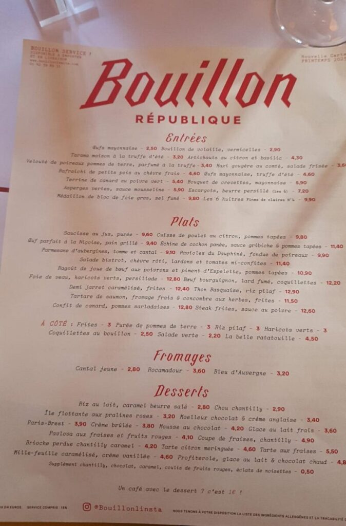 Menu from Bouillon République with sections for "Entrées," "Plats," "Fromages," and "Desserts." Text is in red and script style, creating a classic French bistro ambiance.