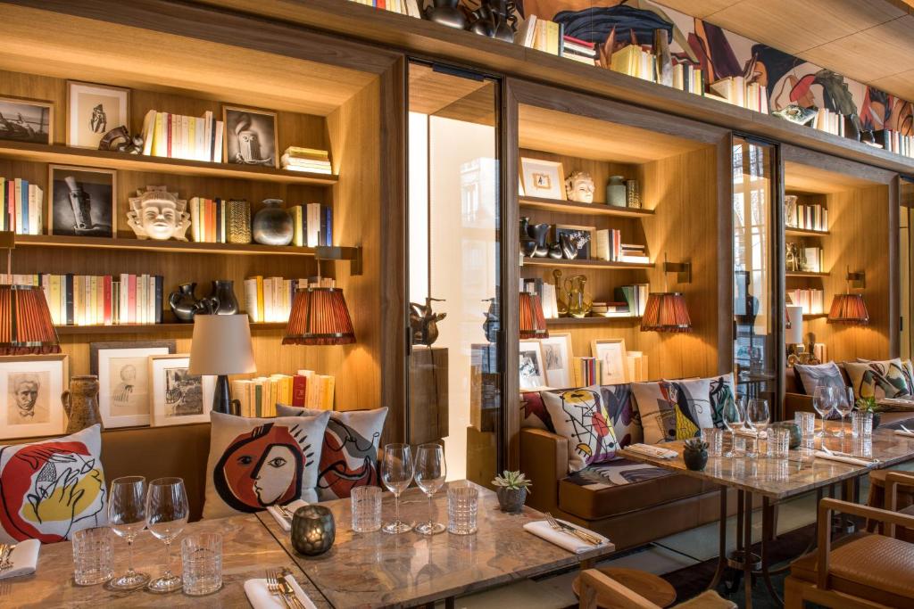 Brach Paris offers a lavish array of amenities, including a wellness spa, gourmet dining options, and a rooftop terrace with panoramic views.