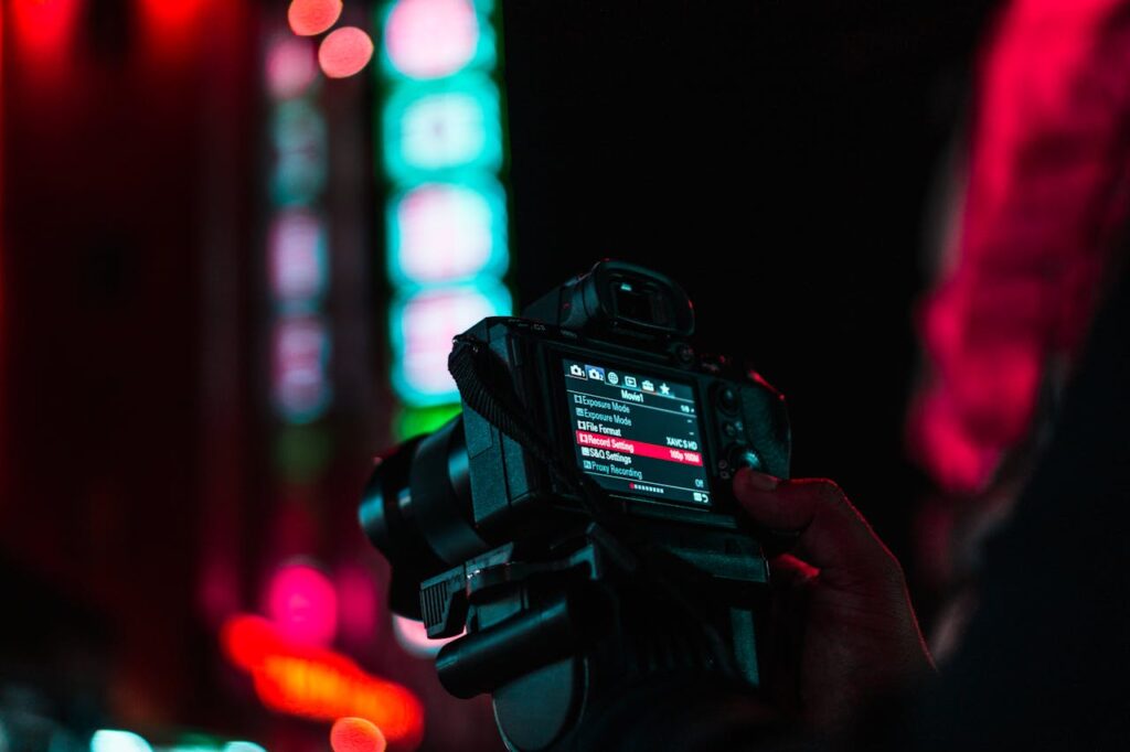 Man adjusting the camera setting