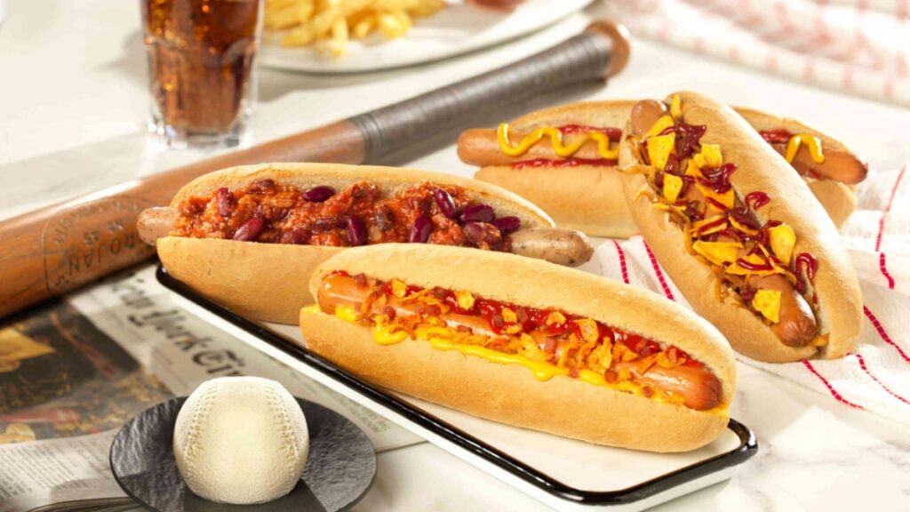 Casey’s Corner Disneyland Paris gourmet hot dogs on a tray with diverse toppings
