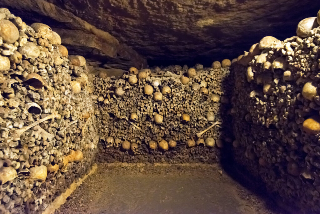 Stocked bones and skulls in Les catacombes de Paris or the Catacombs of Paris