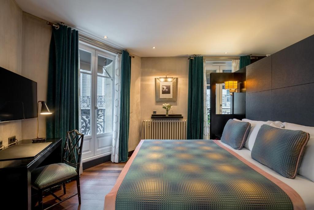 Bed and room interior in Chalgrin Boutique Hotel