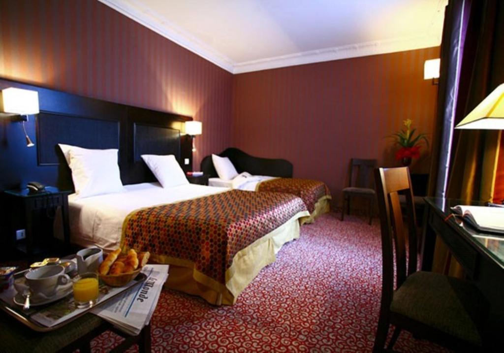 Experience modern comfort at Hôtel Convention Montparnasse, where rooms showcase contemporary design, functional amenities, and a cozy ambiance.