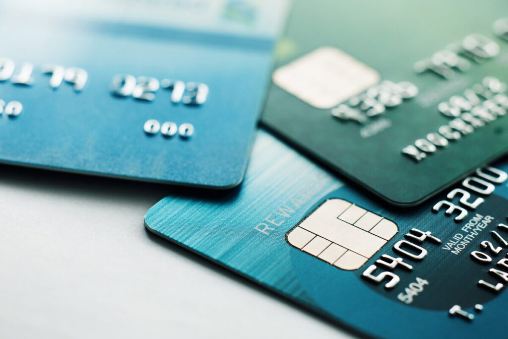 Close-up of a credit card being used for payment, with a selective focus on the card details.