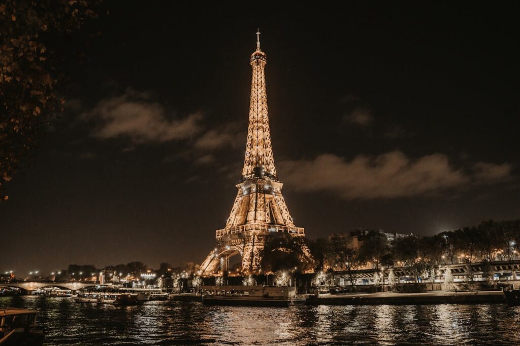 Bright night lights of the Eiffel Tower in Paris, France