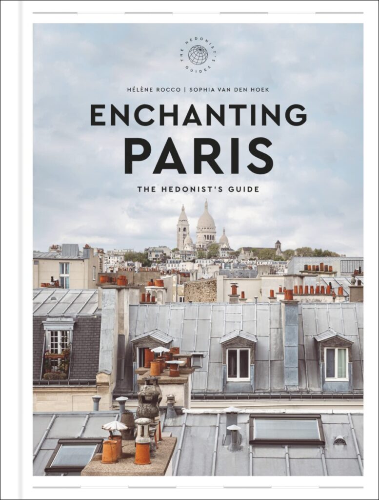 Enchanting Paris guidebook cover with rooftop view and Sacré-Cœur.