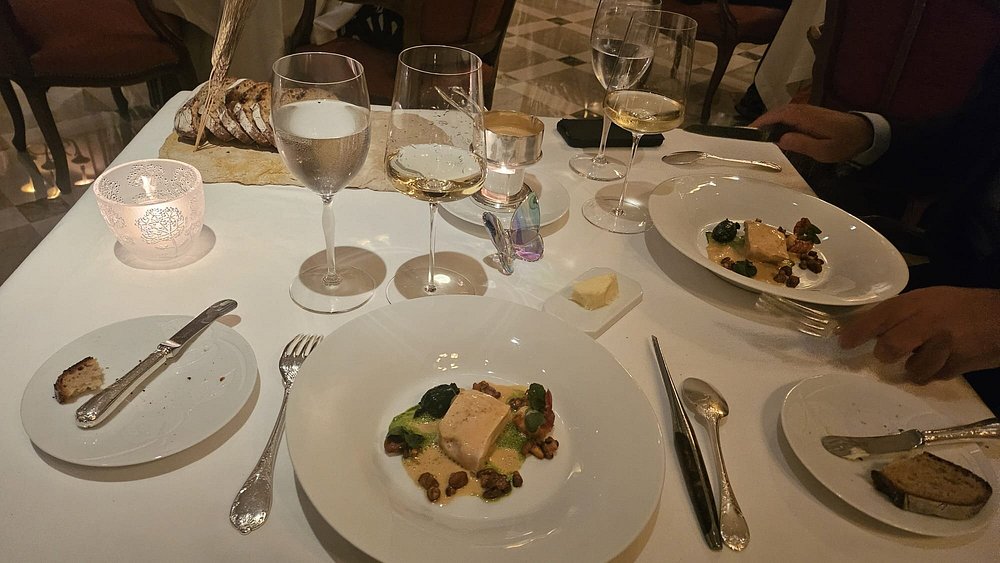 Luxurious food presentation at Epicure restaurant in Paris, showcasing gourmet dishes in an elegant setting.