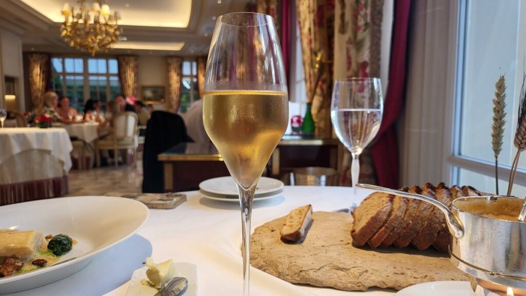 Glass of wine elegantly served at Epicure Paris
