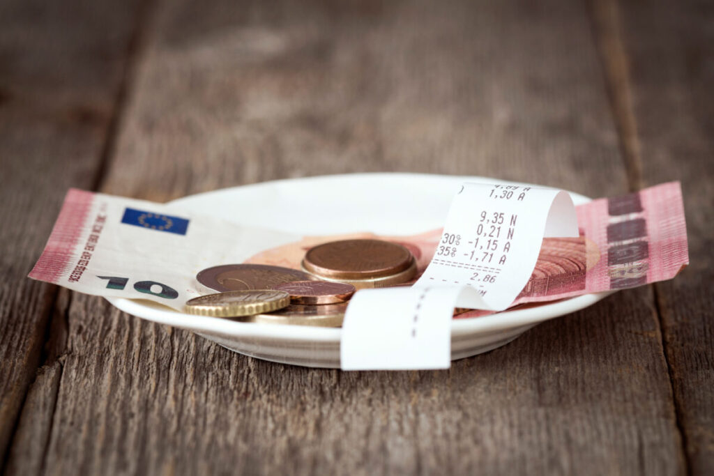 Close-up of Euro currency, featuring colorful bills and different coins, highlighting their unique designs and values