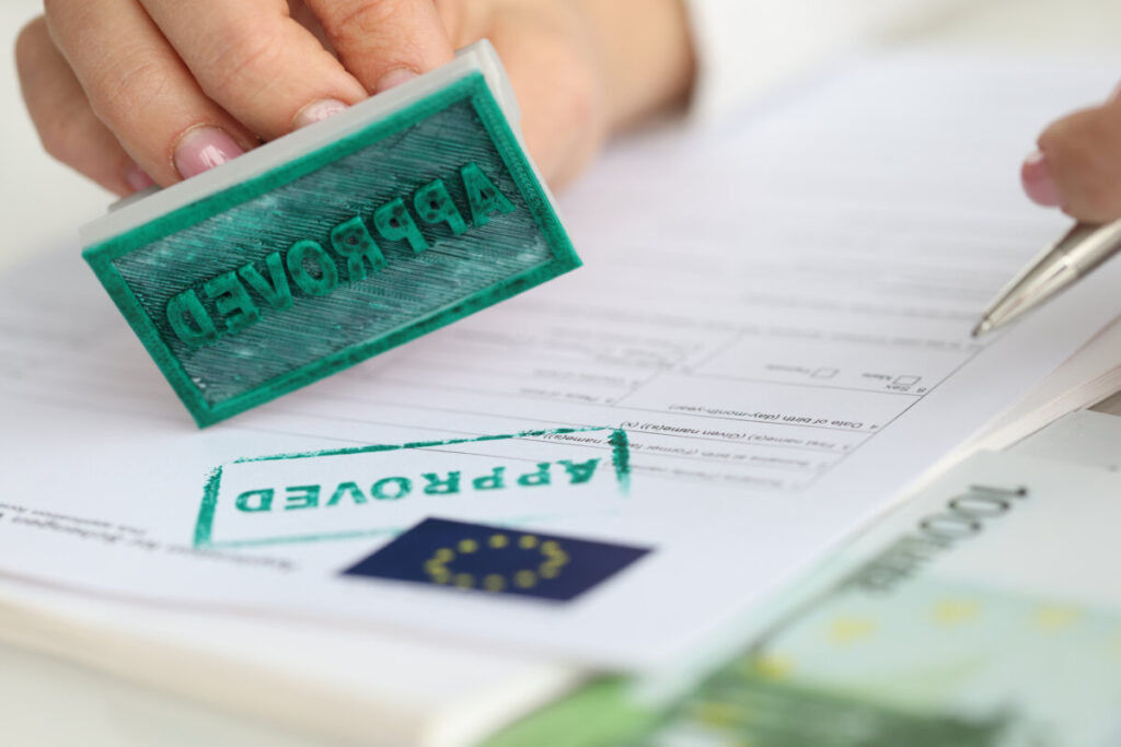 EU Schengen visa application document with an approved stamp, indicating successful visa processing.