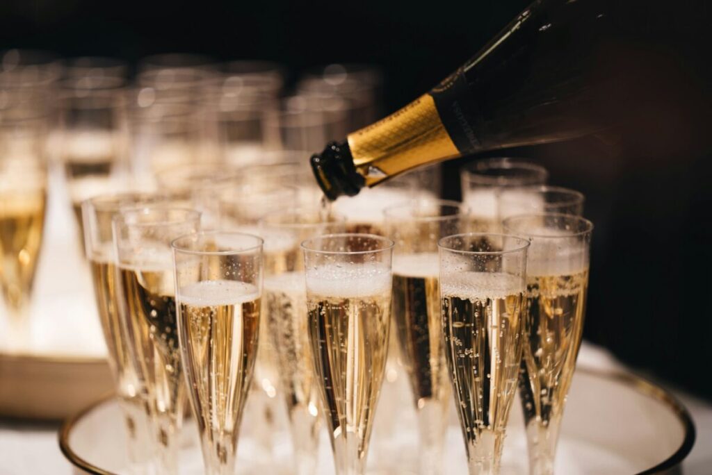 Pouring champagne on glasses