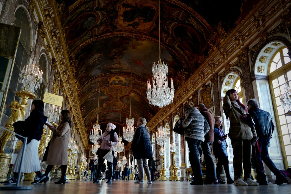 Tourists on a tour in Hall of Mirrors, Versailles, France