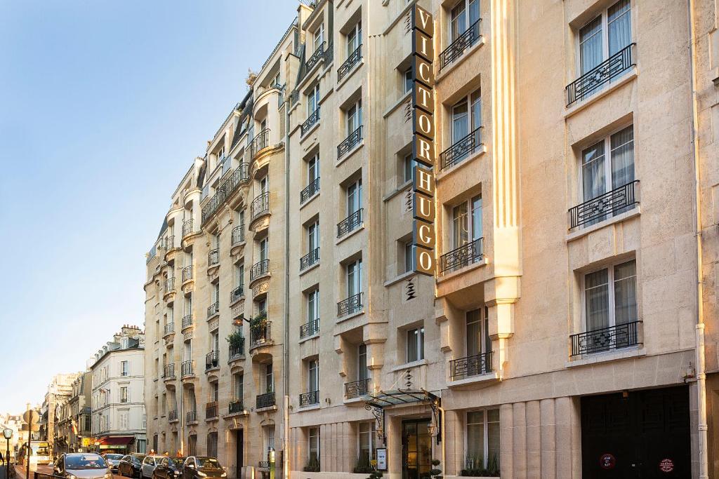 Hôtel Victor Hugo Paris Kléber: A grand facade with timeless Parisian architecture welcomes guests into an opulent lobby, setting the tone for a sophisticated and luxurious stay.