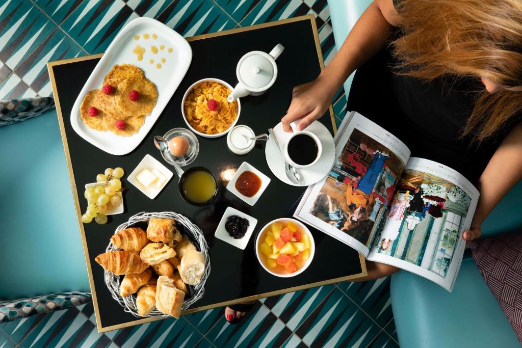Savor a culinary journey at Hôtel Artus where dining is an exquisite fusion of flavors and ambiance.