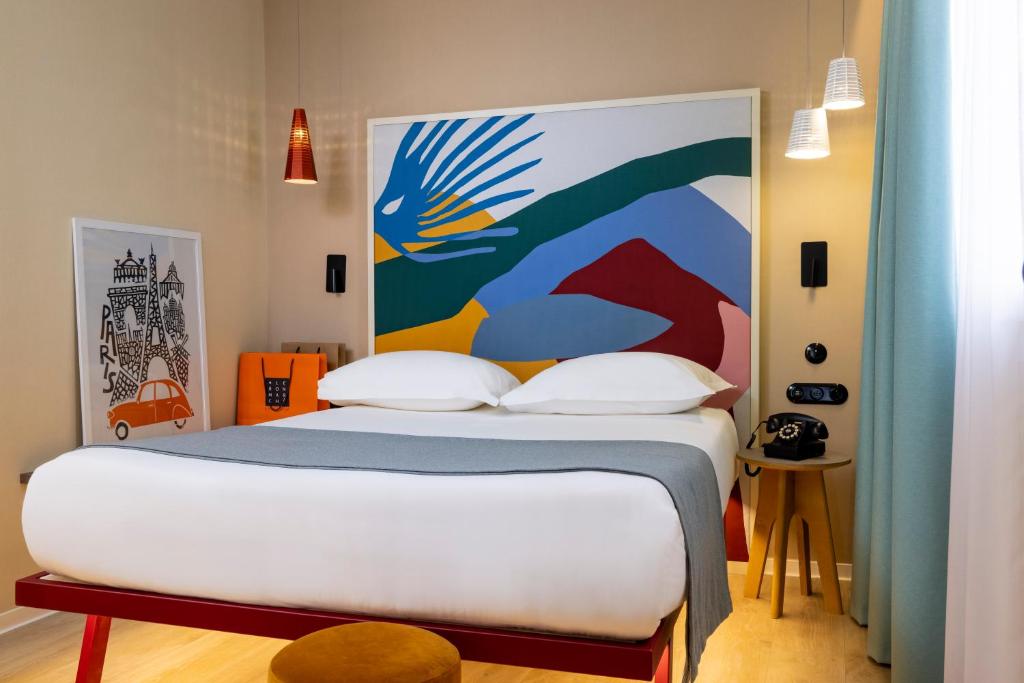 Hôtel De La Paix rooms blend classic elegance with modern comfort, offering tasteful decor, luxurious furnishings, and thoughtful amenities.