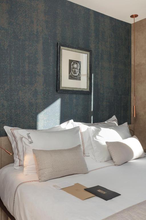 Hôtel de Lille's rooms boast a harmonious fusion of classic Parisian charm and modern comfort.