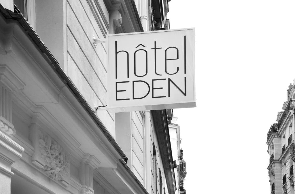 A welcoming atmosphere is created for guests in the Hôtel Eden Paris Porte de Versailles lobby by the elegant decor and gentle ambient lighting, which exude a subtle appeal.