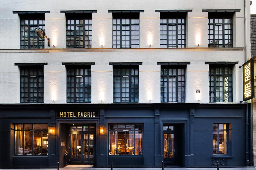 Hotel Fabric in Paris, showcasing a stylish club atmosphere with modern decor and inviting seating areas.