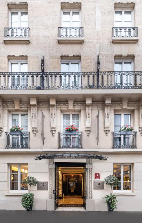 Hôtel Le Marquis by Inwood Hotels: A striking facade and contemporary entrance welcome guests, setting the stage for an upscale and stylish stay in the heart of Paris.
