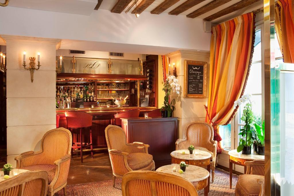 The refined dining area at Hotel Luxembourg Parc, adorned with chic decor and soft lighting, offering an exquisite setting for enjoying gourmet cuisine.