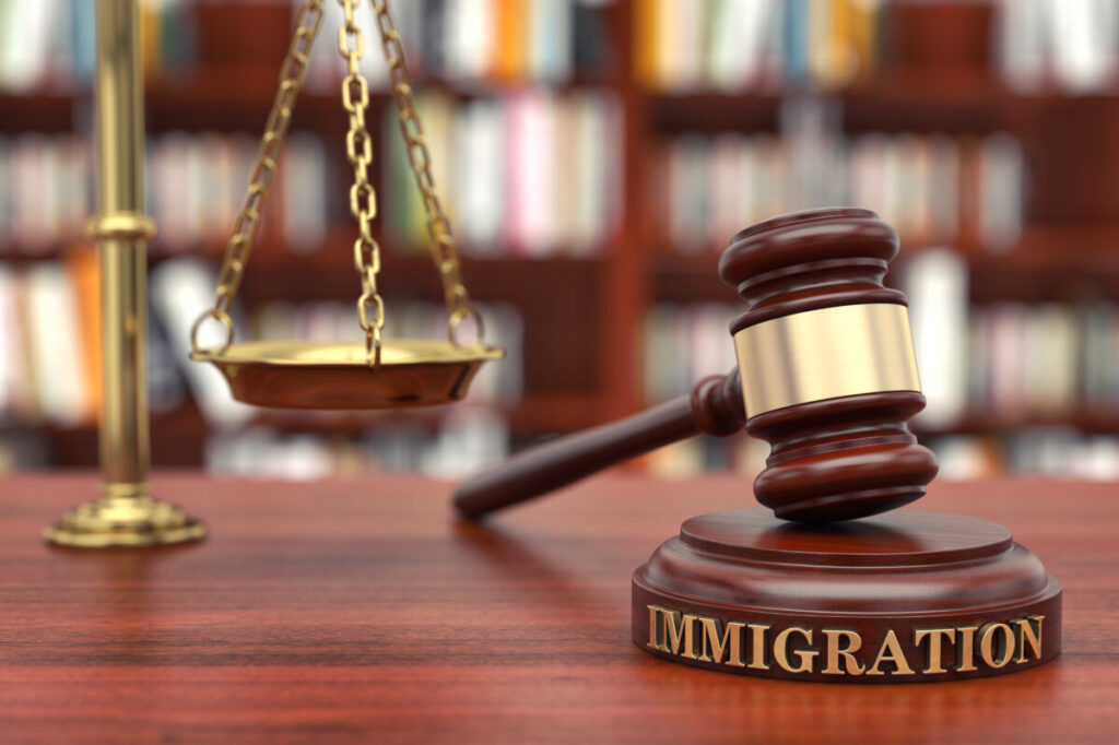 Court mallet on a stand with an embossed immigration word