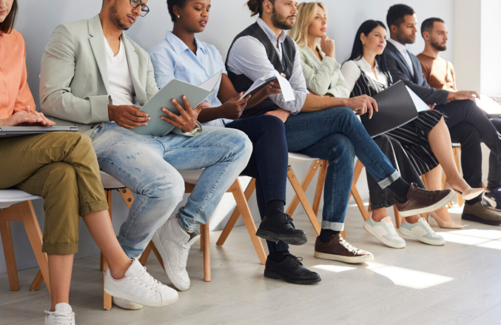 Job applicants sitting and waiting for an interview