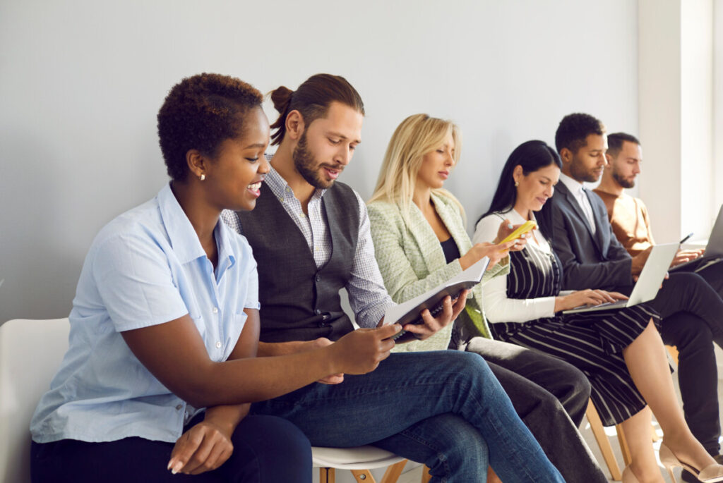 Job candidates sitting and waiting for an interview