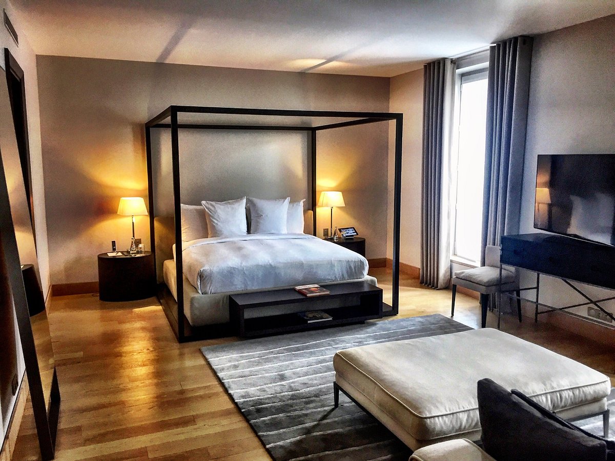 Room interior and bed in La Reserve Paris Apartments